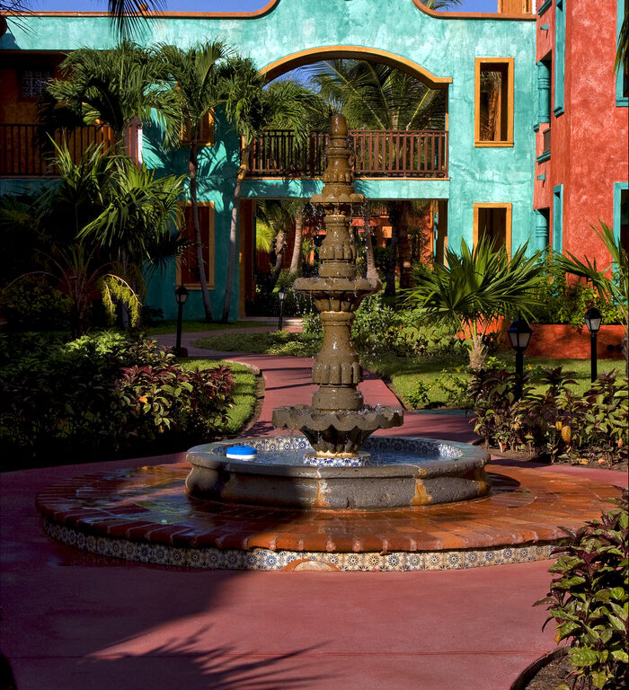 mexico bush  fountain and red house  in playa del carmen