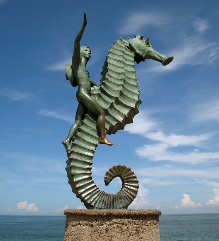 Photo of the seahorse statue otherwise known as ""Caballeo del Mar"" in Puerto Vallarta Mexico.  This statue is located on the boardwalk or Malecon and was created in 1976 by Rafel Zamarripa.  This public statue is one of Puerto Vallarta's most famous landmarks.